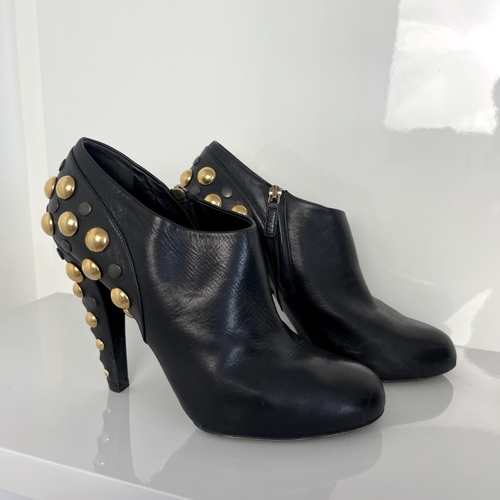 Gucci Leather Ankle Boots with gold metal design